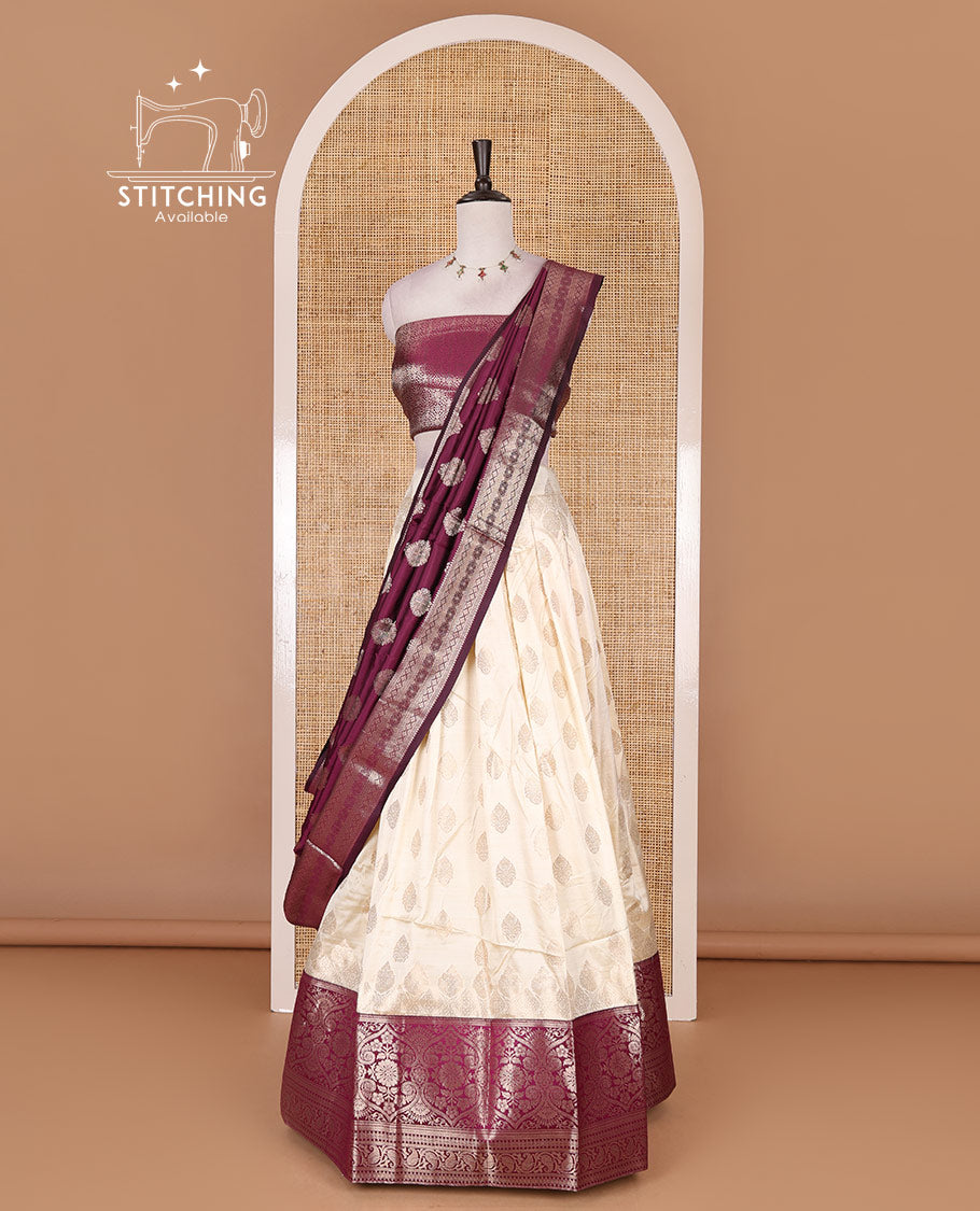 Cream with purple semi-banarasi half-saree, zari buttas with contrast traditional zari border skirt, zari jacquard blouse, and zari design dhavani