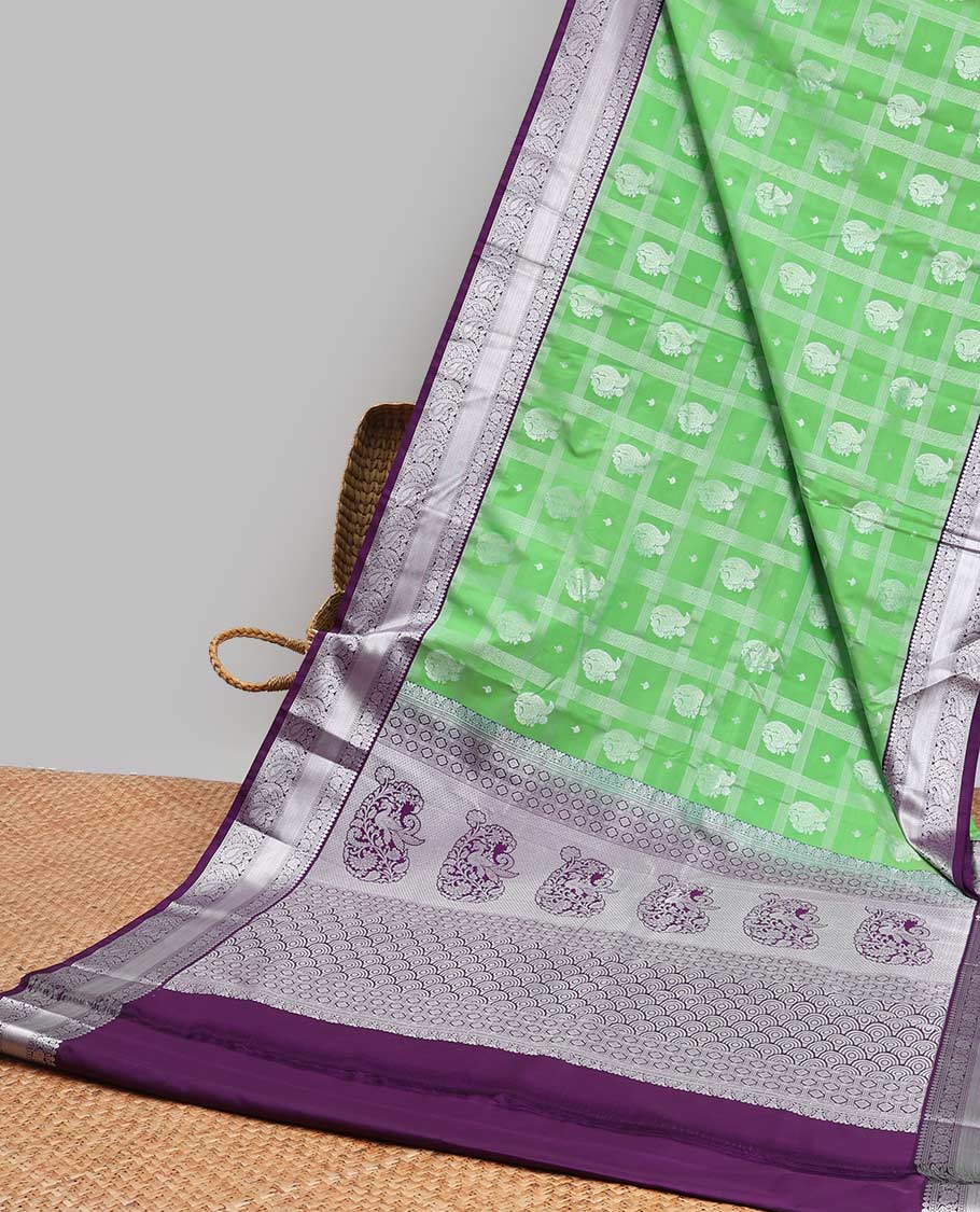 Green paisely enclosed checked design gift saree with contrast zari design border & checked zari design pallu