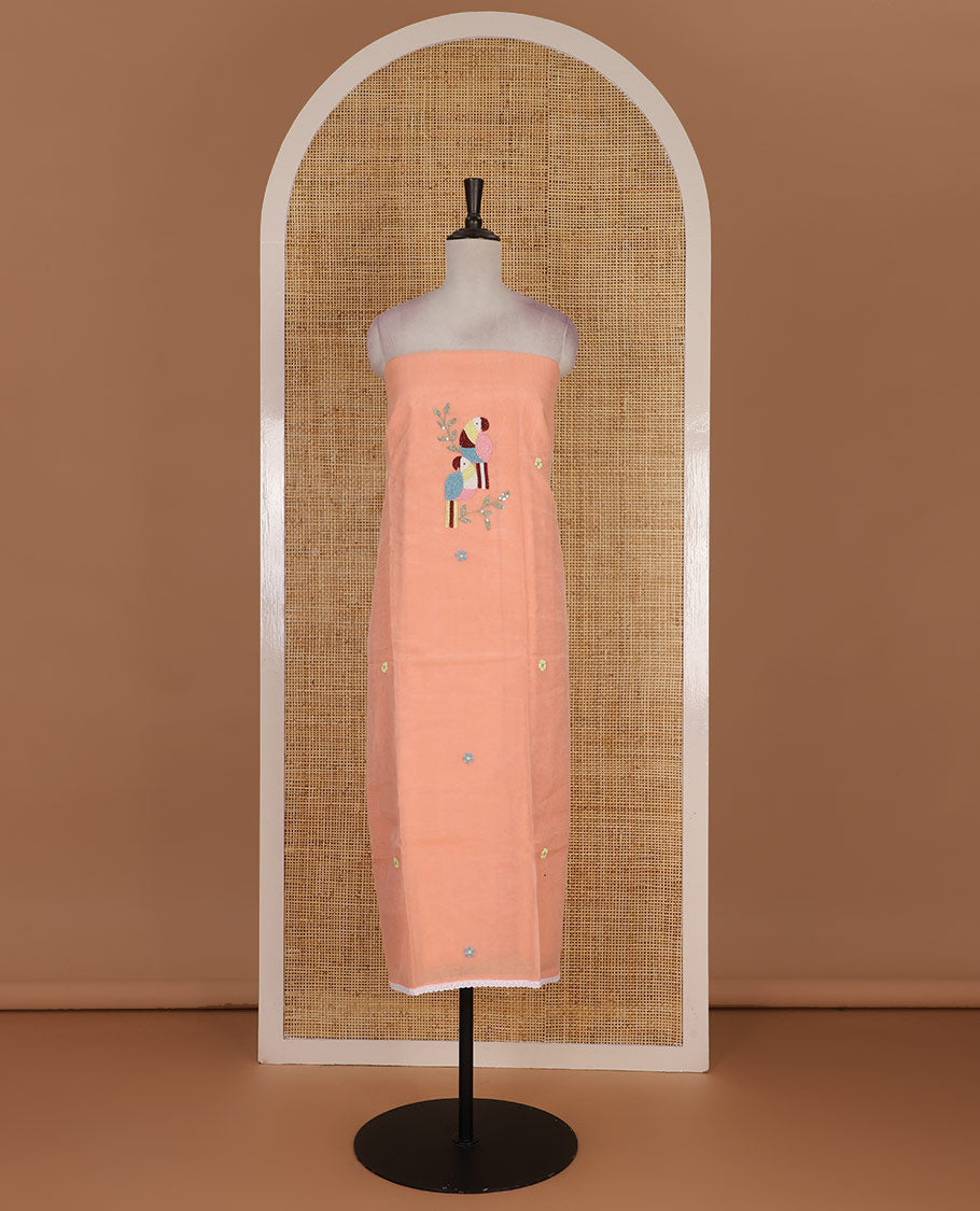 Peach net kota material chudidar set, macaw parrot, and flower motifs, multi-color sugar bead embroidered top, plain santoon bottom, and sugar bead embroidered dupatta