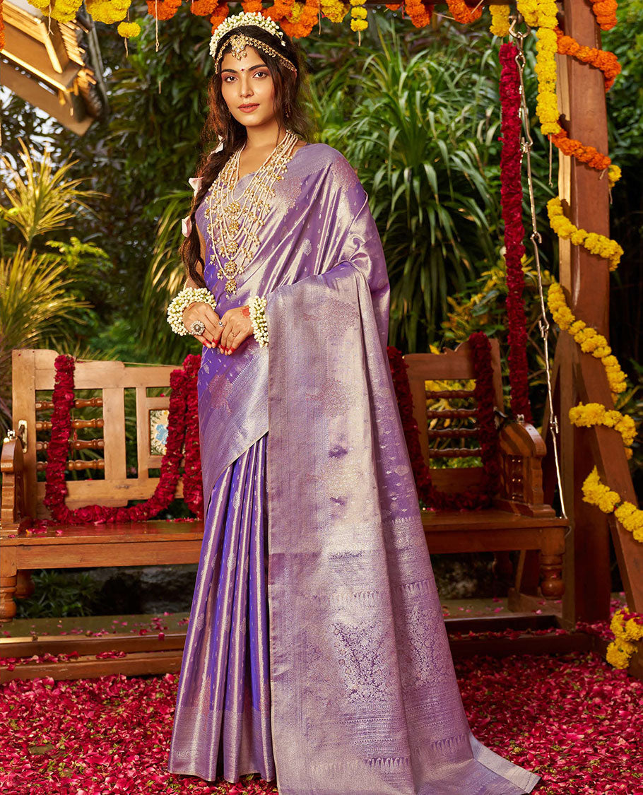 Violet Designer Catalog Saree, Majestically Detailed with Buttas All Over Its Body, Subtly Woven Border of Tree Designs, Pallu Depicts Intricate Designs, and Paired with a Matching Blouse
