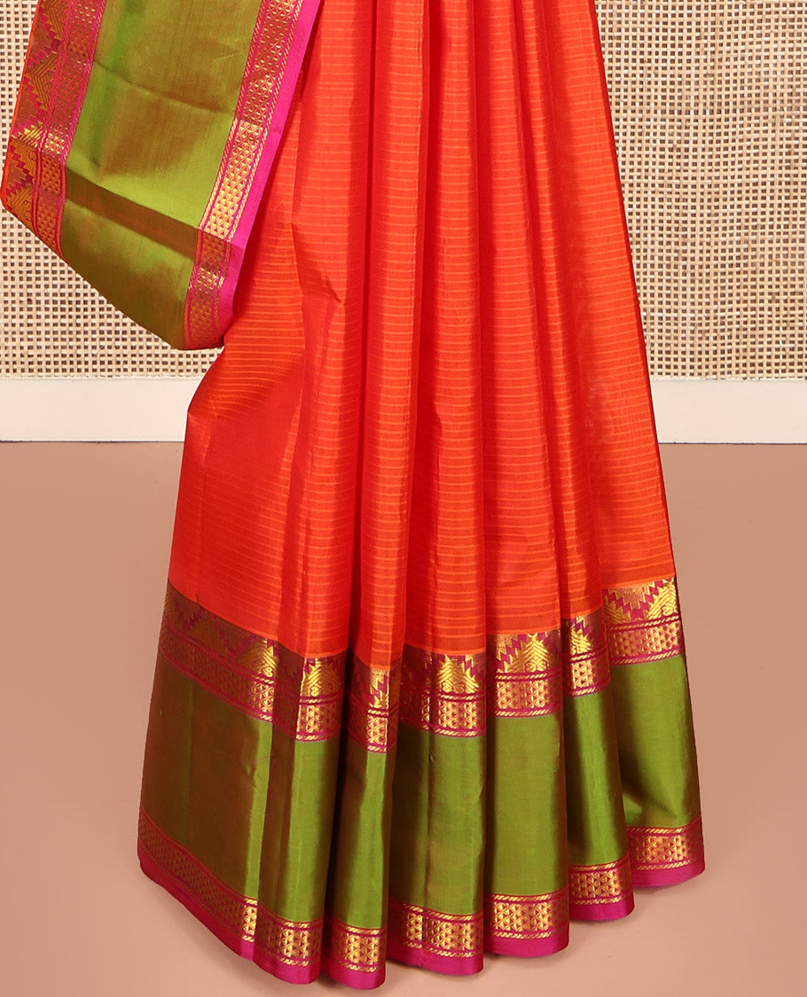 Orange Kanchipuram Silk Saree, Sparsely Woven with Vazhai Poo Stripes on Its Body, Complemented by Contrast Rettai Pettu Border of Thazampoo Rekku, and Ara Maadam Designs, Zari-Striped Pallu, and Paired with a Contrast Blouse
