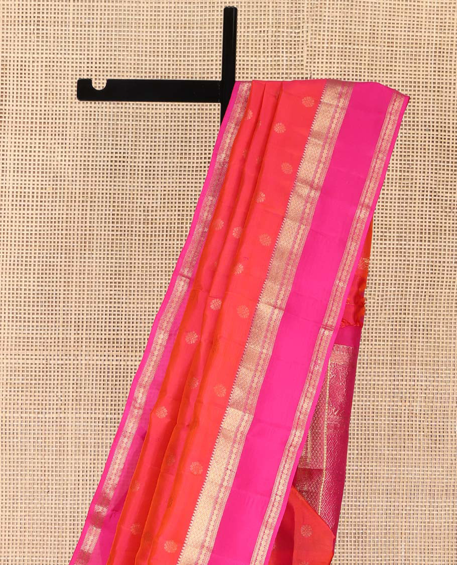 Orange Kanchipuram Silk Saree, Elevated with Zari Buttas on Its Body, Complemented by a Contrast Rettai Pettu Border of Rekku, Mayil Kann, and Kathir Designs, Grand Pallu of Jaal Designs, and Paired with a Contrast Blouse