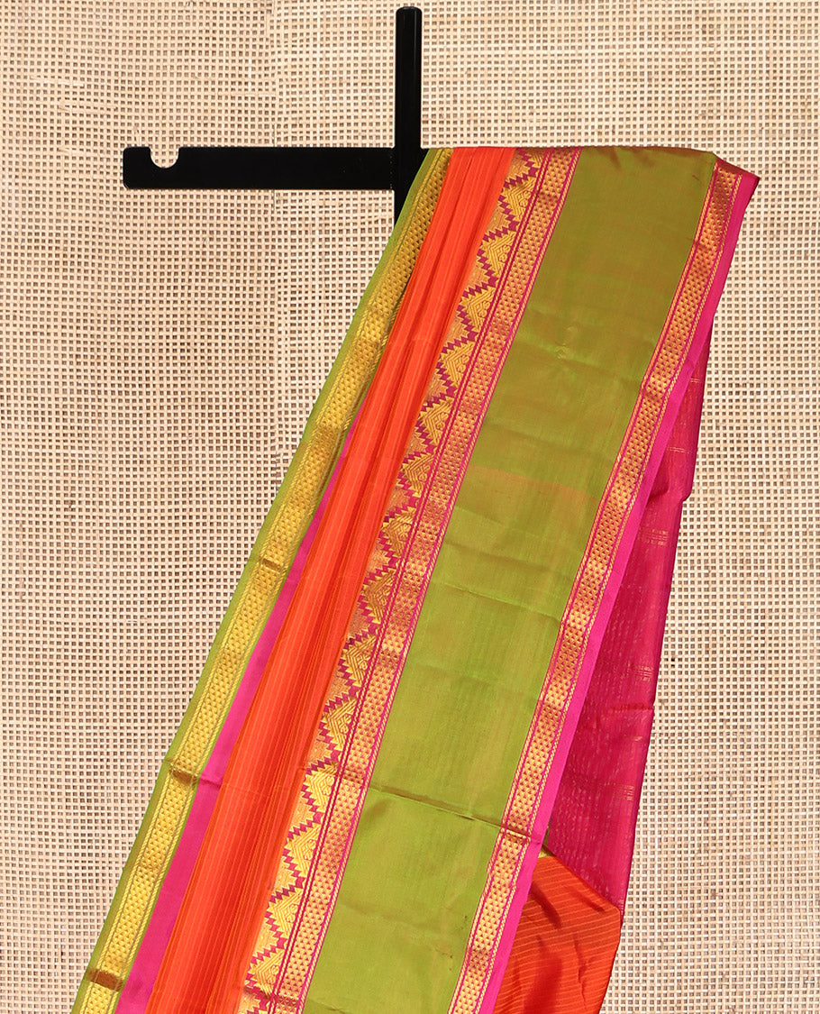 Orange Kanchipuram Silk Saree, Sparsely Woven with Vazhai Poo Stripes on Its Body, Complemented by Contrast Rettai Pettu Border of Thazampoo Rekku, and Ara Maadam Designs, Zari-Striped Pallu, and Paired with a Contrast Blouse