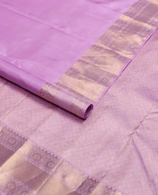 Purple buttas kancheepuram silk saree with self border of rekku,paun, mayil kann design & argyle design pallu