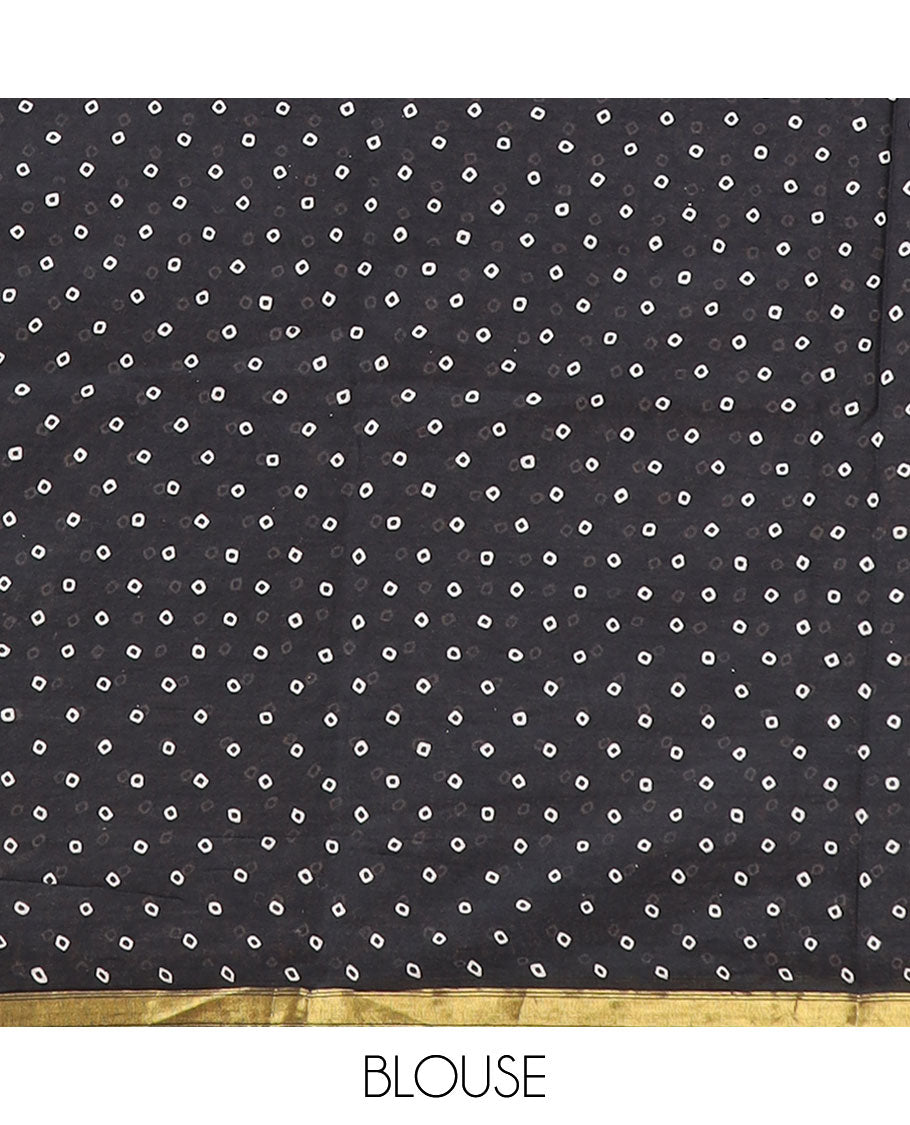 Black worli printed mul mul soft cotton saree with gold zari piping border & worli printed pallu along with bandhini printed blouse