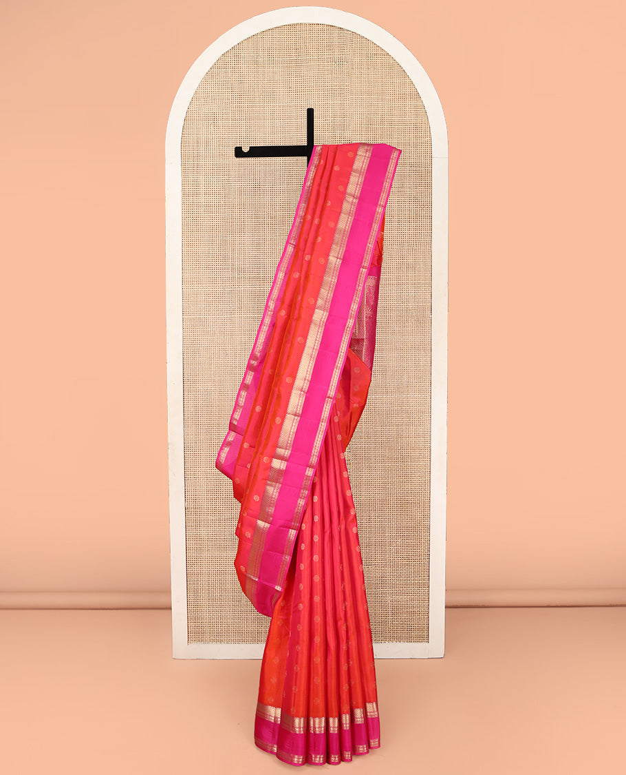 Orange Kanchipuram Silk Saree, Elevated with Zari Buttas on Its Body, Complemented by a Contrast Rettai Pettu Border of Rekku, Mayil Kann, and Kathir Designs, Grand Pallu of Jaal Designs, and Paired with a Contrast Blouse