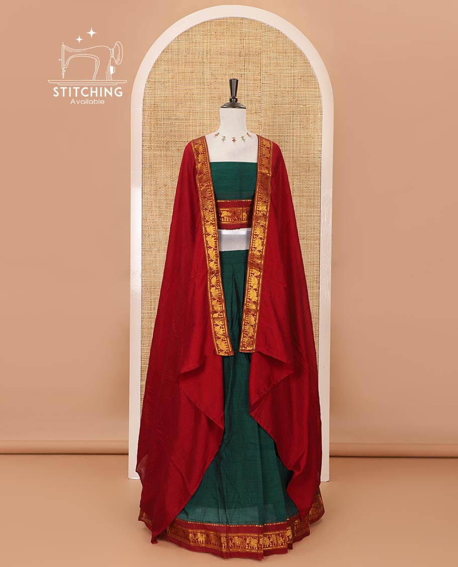 Green mercedised cotton half-saree, plain contrast elephant zari border skirt, matching blouse & contrast maroon zari elephant border dhavani