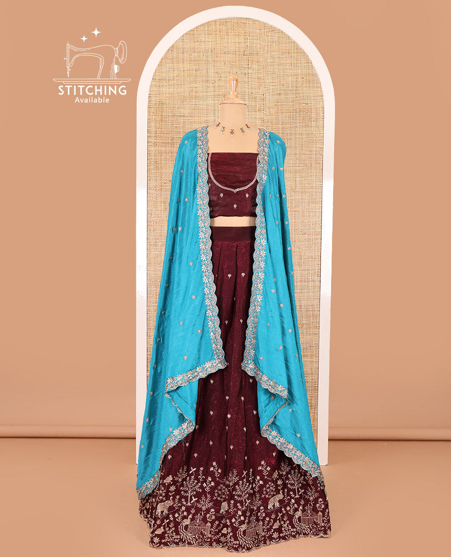 Wine half-saree, buttas and flora-fauna embroidered bordered velvet organza skirt, a matching velvet organza blouse, and a contrast embroidered scallop syska georgette dhavanif