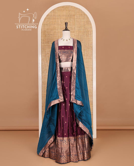 Wine taffeta silk half saree, zari buttas with contrast blue traditional zari border skirt, matching zari design blouse, and contrast plain zari border syska georgette dhavani