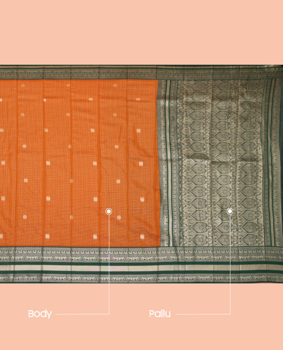 Orange Litchi Saree, Highlighted with Peacock-Chakram Buttas and Checks, a Contrast Traditional Zari Border, Intricate Pallu, and a Contrast Blouse