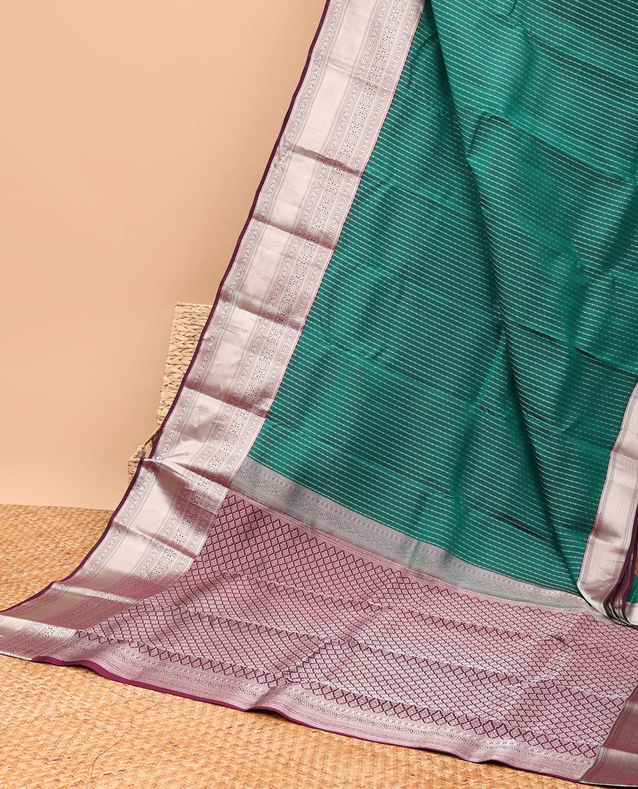 Green small buttas vasundhara elite silk saree with self intricate zari design border & pallu of argyle design