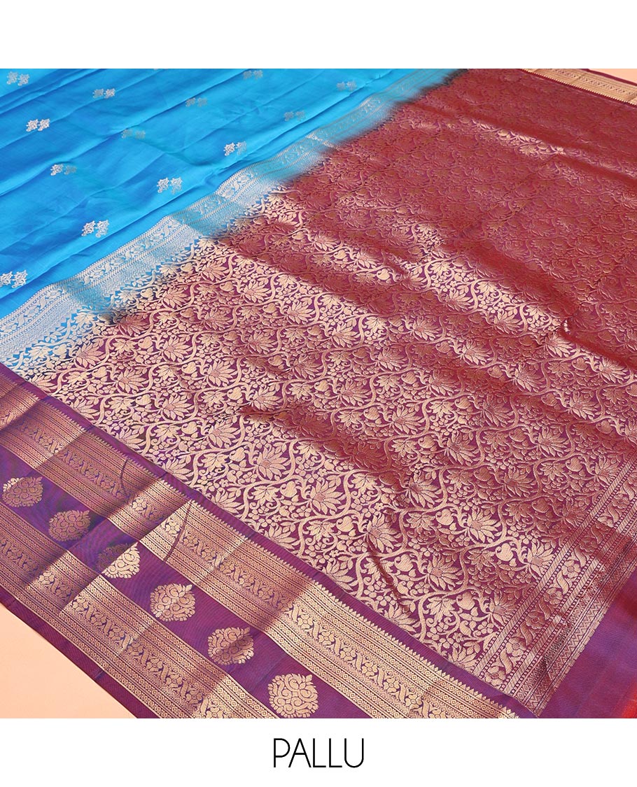Blue Vasundhara Lite Silk Mix Saree, Elevated with Zari Buttas All Over Its Body, Complemented by a Contrast Border of Rekku, Diamond, Cross Kamalam and Zari Designs, Grand Floral Design Pallu, and Paired with a Contrast Blouse