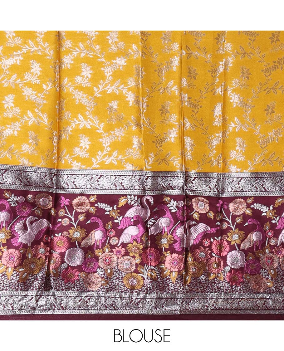 Haldi yellow taffeta silk half saree, floral jaal jacquard skirt, contrast wine zari meenakari style bird border, matching blouse, and floral jaal dhavani