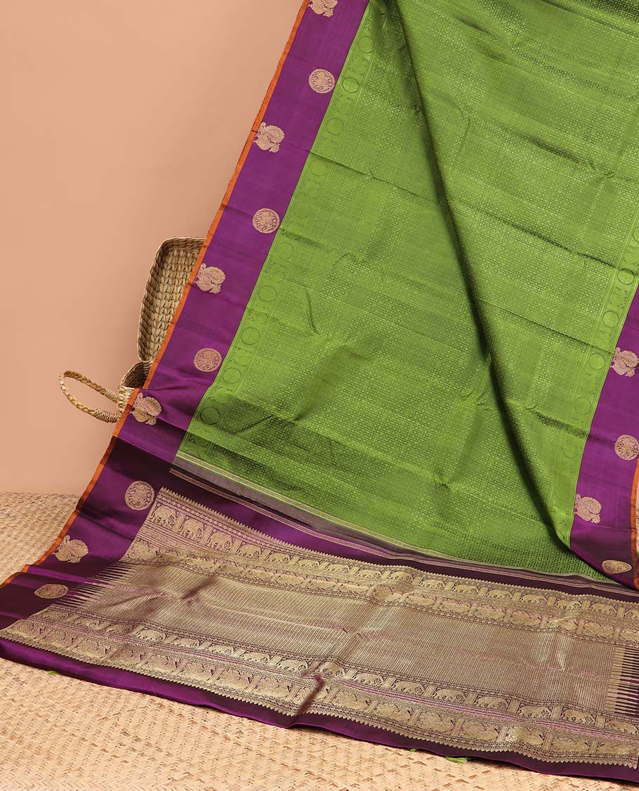 Green floral enclosed with checked design silk saree with contrast border of mayil & intricate zari design pallu