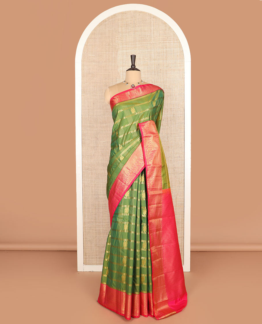 Green buttas with checked budget silk saree, contrast varisai pettu traditional zari border, and intricately woven pallu