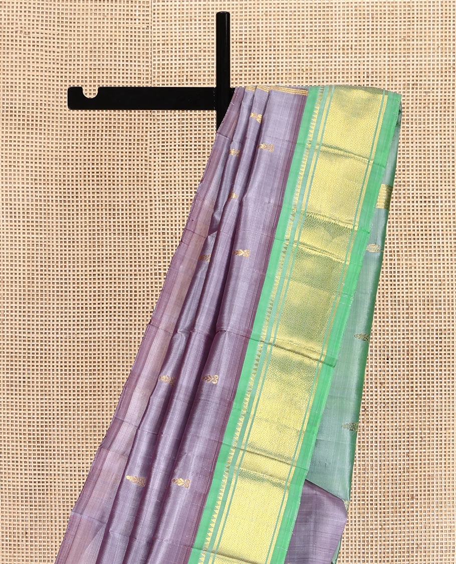 Grey Kanchipuram Silk Saree, Detailed with Zari Buttas, a Contrast One-Sided Border of Rekku, Banaras, and Jaal Designs, Zari Design Pallu, and No Blouse