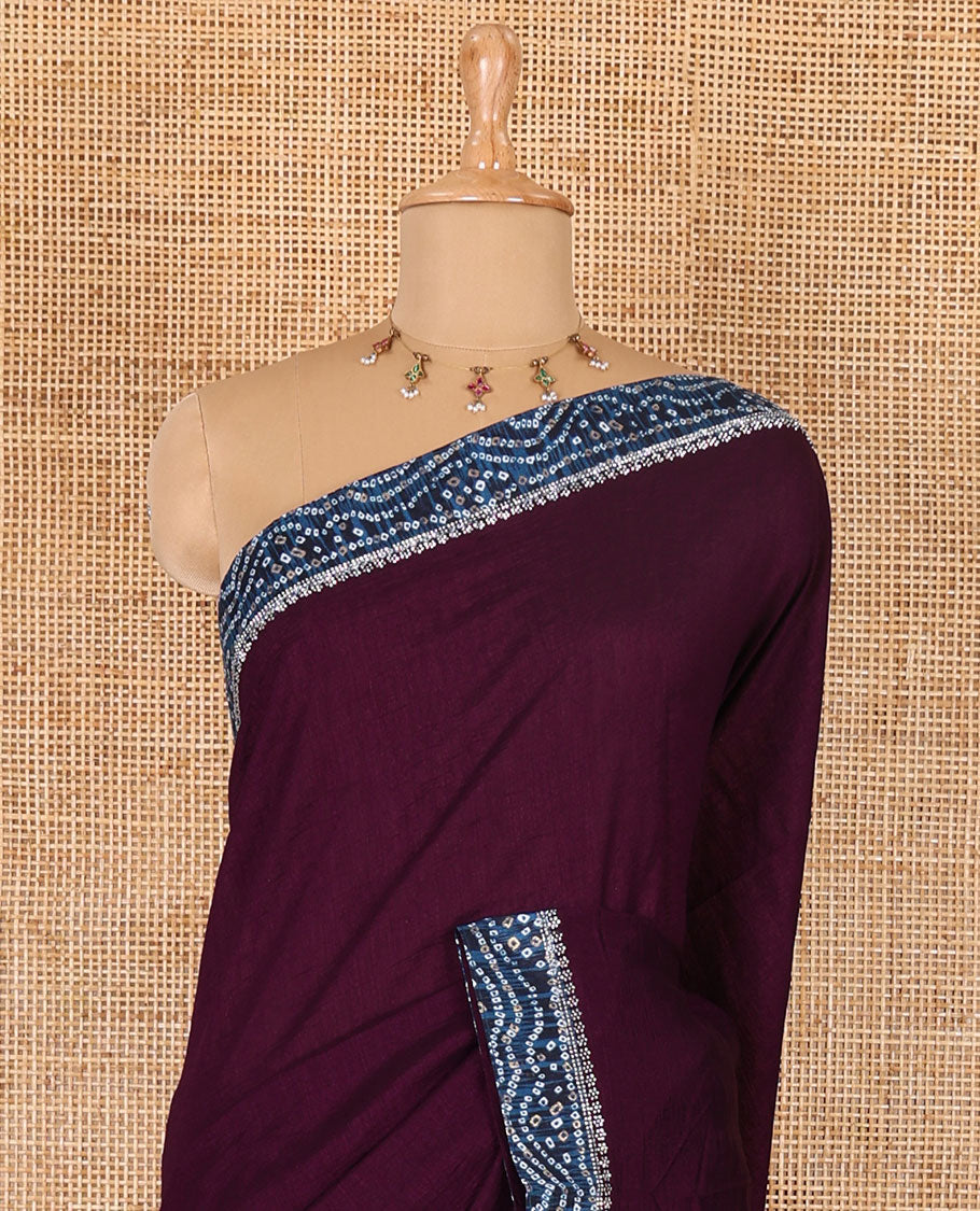 Wine plain Vichitra silk saree, contrast bandhani printed with Swarovski micro-stonework border, and a contrast bandhani printed blouse