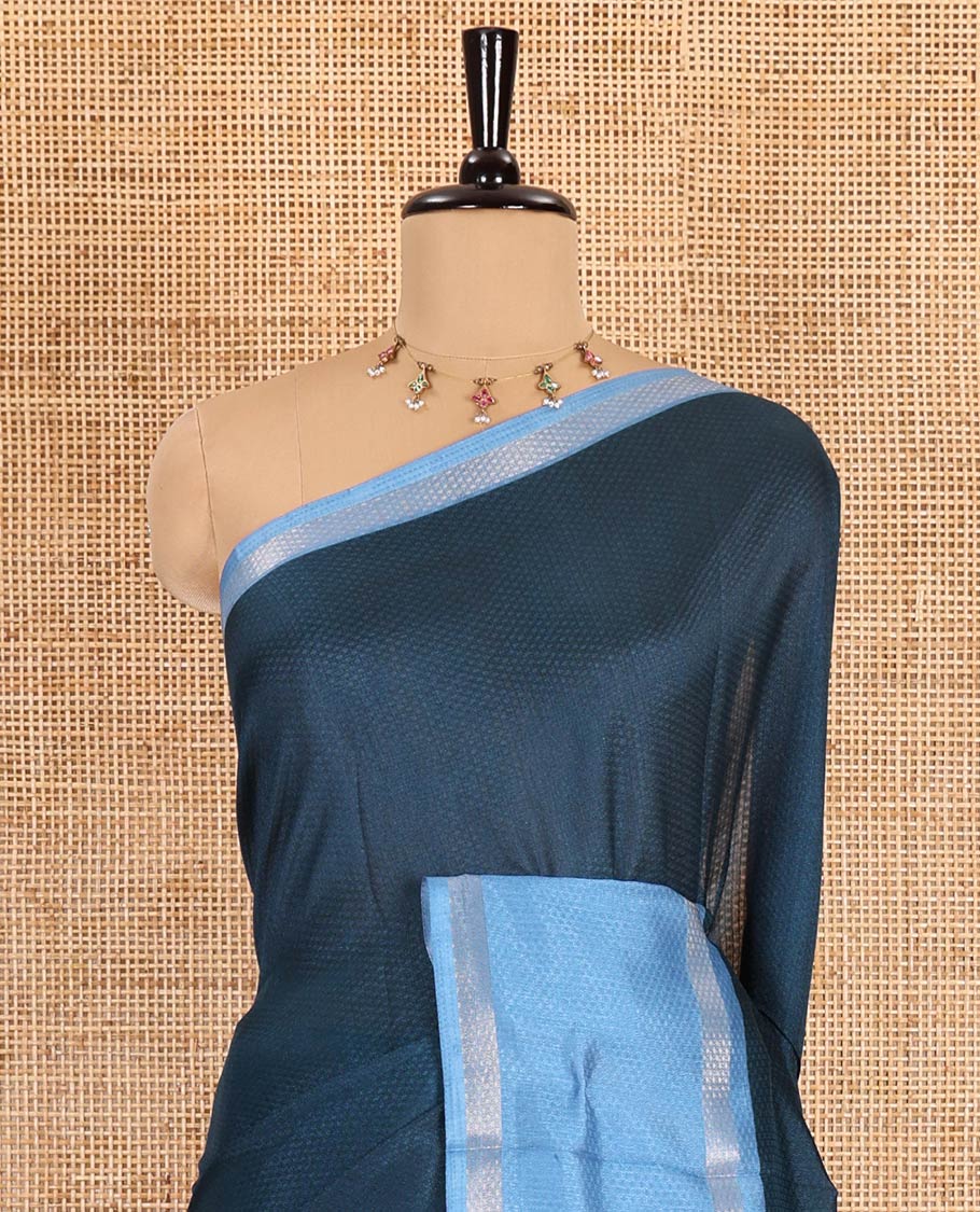 Blue embossed moss chiffon saree, contrast traditional rettai pettu border, embossed pallu, and a contrast embossed blouse