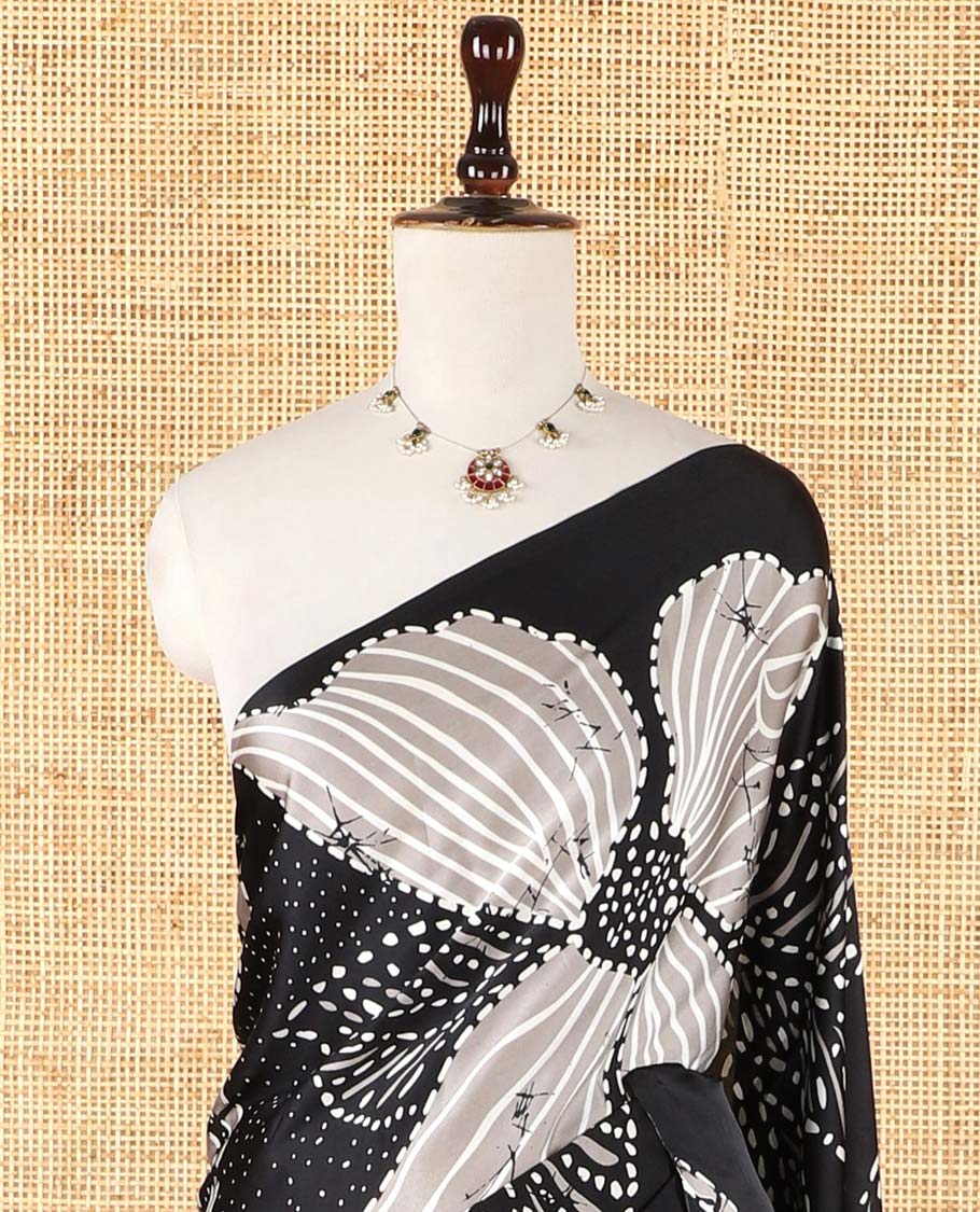 Borderless black half-and-half model satin saree with batik-style big floral motifs digital printed body and pallu
