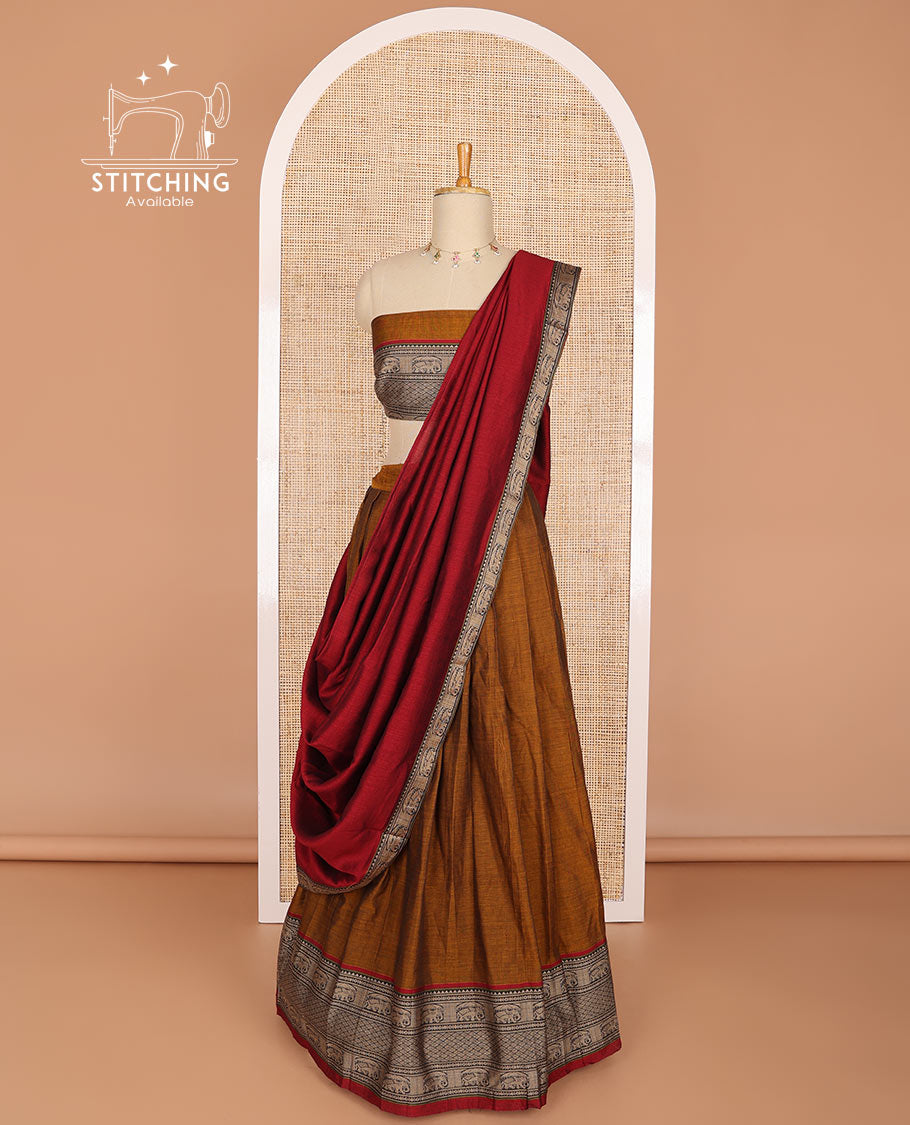 Brown cotton half saree with contrast elephant motifs border, elephant design blouse & elephant design border dhavani