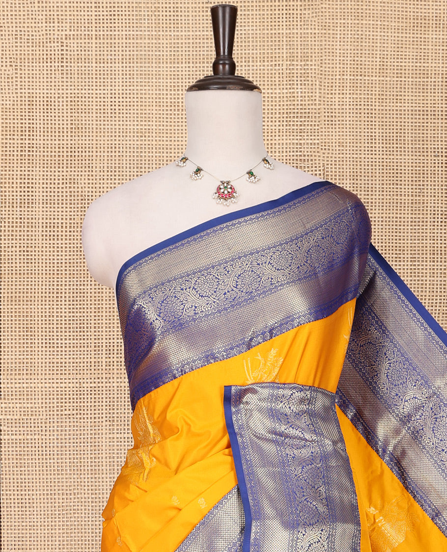 Orange Budget Silk Saree, Delicately Woven with Floral Zari Buttas All Over Its Body, Complemented by a Contrast Traditional Zari Border of Floral Creeper Designs, Grand Pallu of Jaal and Thilakam Designs, and Paired with a Contrast Blouse
