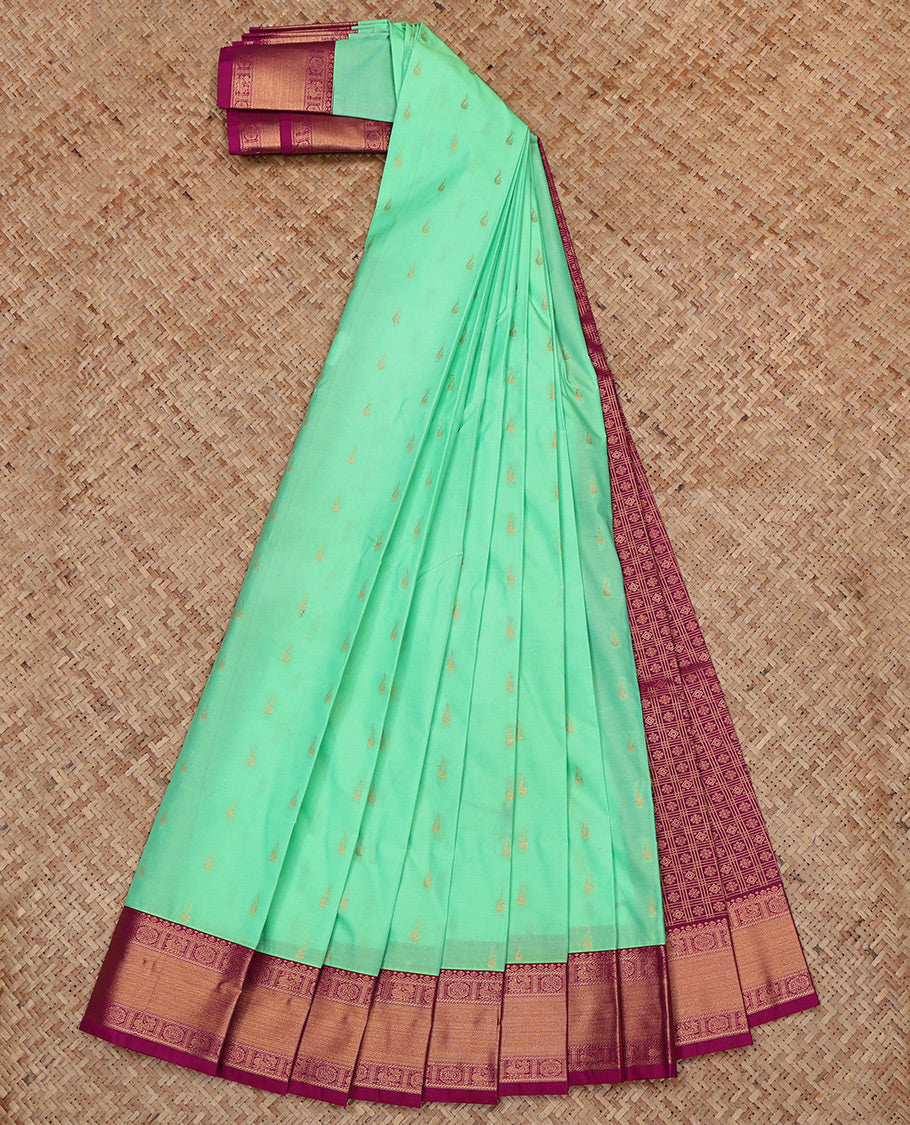 Green Budget Silk Saree, Elevated with Zari Buttas All Over Its Body, Complemented by a Contrast Traditional Peacock-Chakram Zari Border, Grand Butta Enclosed Checked Pallu, and Paired with a Contrast Blouse