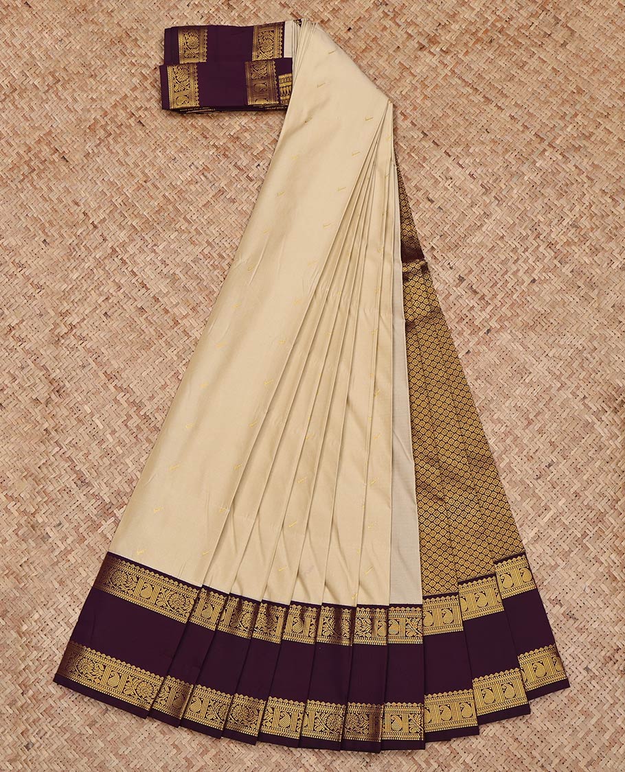 Beige Budget Silk Saree, Subtly Sparkled with Zari Buttas on Its Body, Complemented by Contrast Traditional Zari Design Rettai Pettu Border, Grand Jaal Pallu, and Paired with a Contrast Blouse