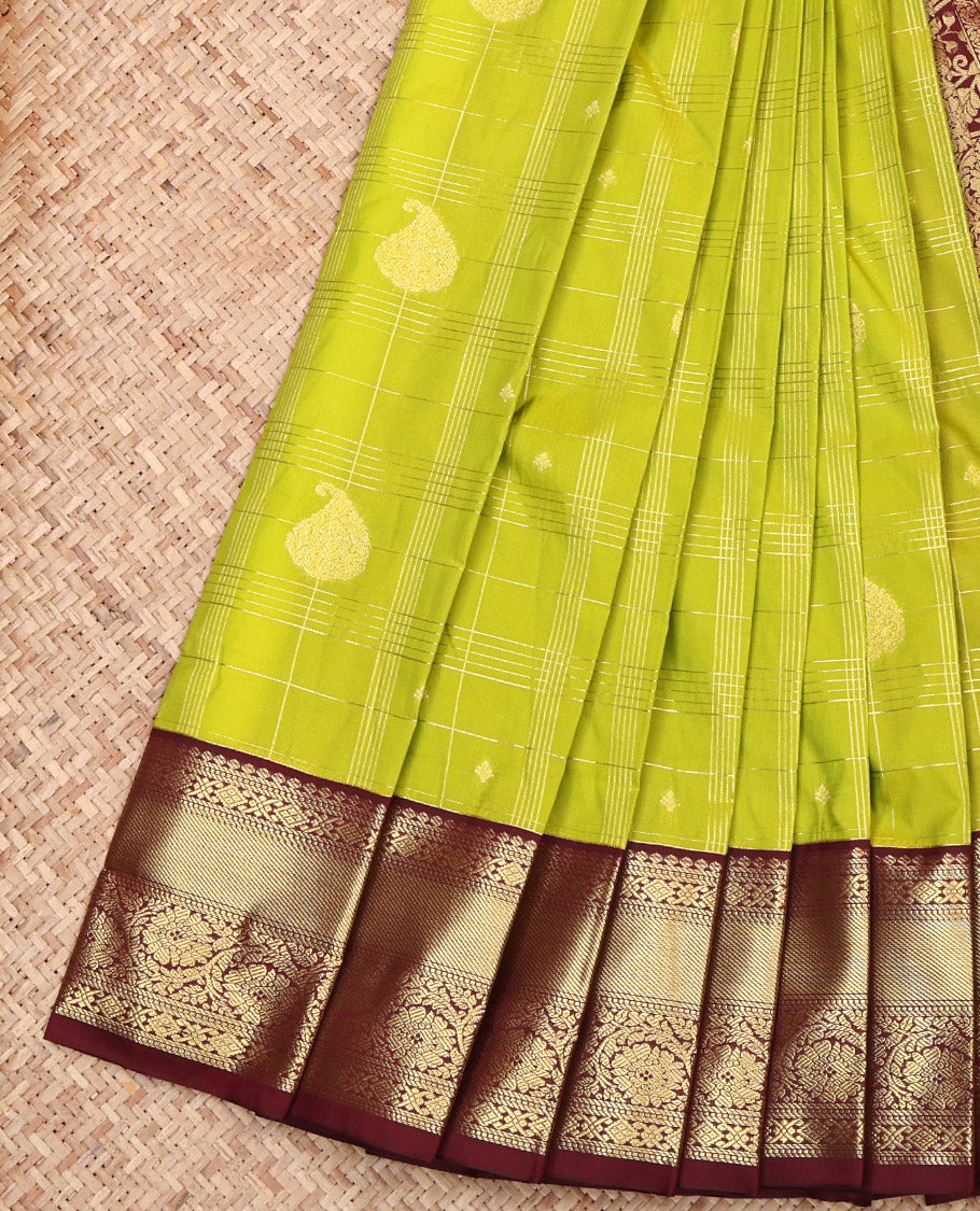 Parrot Green Budget Silk Saree, Opulently Embellished with Zari Butta Enclosed Checked Design on Its Body, Complemented by a Contrast Traditional Zari Design Border, Pallu of Jaal and Paisley Design, and Paired with a Contrast Blouse