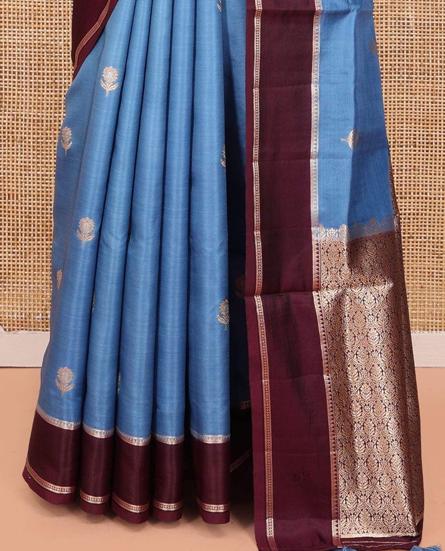 Blue Satin Silk Saree, Mesmerized with Floral Buttas All Over Its Body, Complemented by a Contrast Rettai Pettu Traditional Zari Border, Beautifully Zari Bedecked Pallu, and Paired with a Contrast Blouse