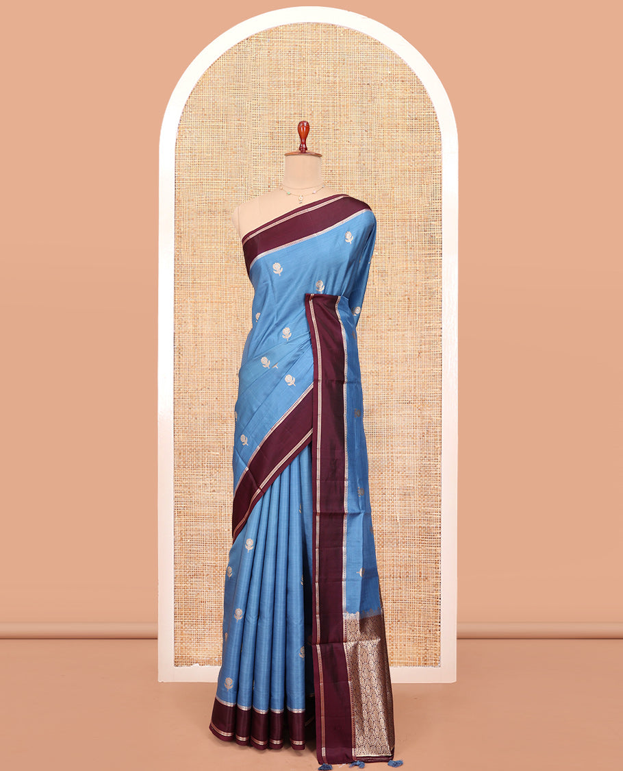 Blue Satin Silk Saree, Mesmerized with Floral Buttas All Over Its Body, Complemented by a Contrast Rettai Pettu Traditional Zari Border, Beautifully Zari Bedecked Pallu, and Paired with a Contrast Blouse