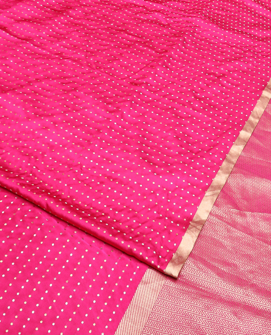 Bright pink dobbly style dotted banarasi silk saree, piping zari border, and chevron striped pallu