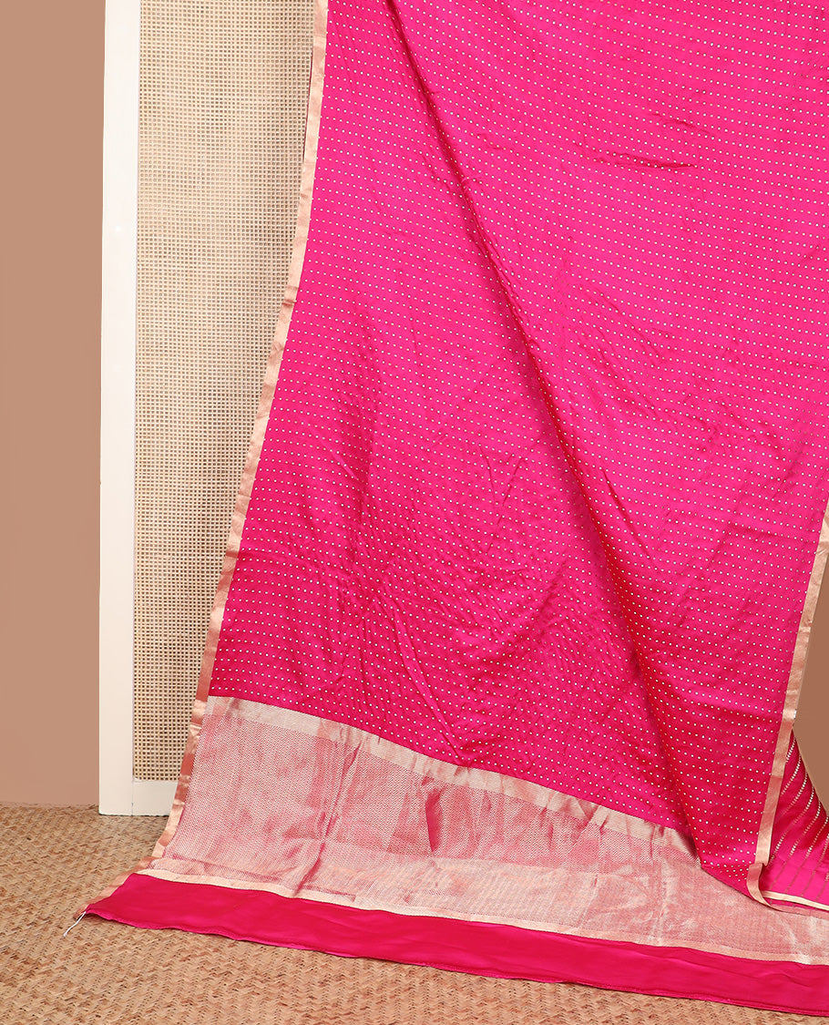 Bright pink dobbly style dotted banarasi silk saree, piping zari border, and chevron striped pallu