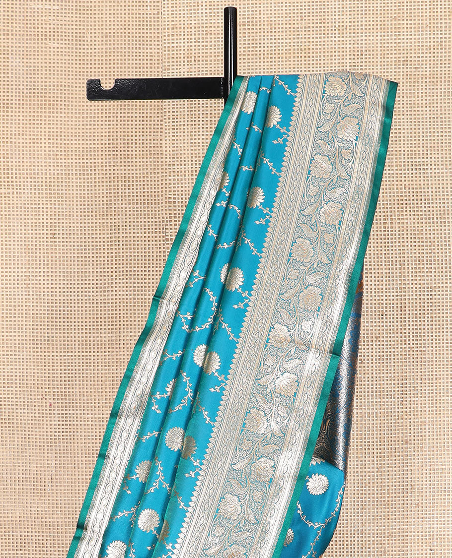 Light blue floral jaal jacquard banarasi silk saree, floral creeper design border, and intricate ogee patterned pallu