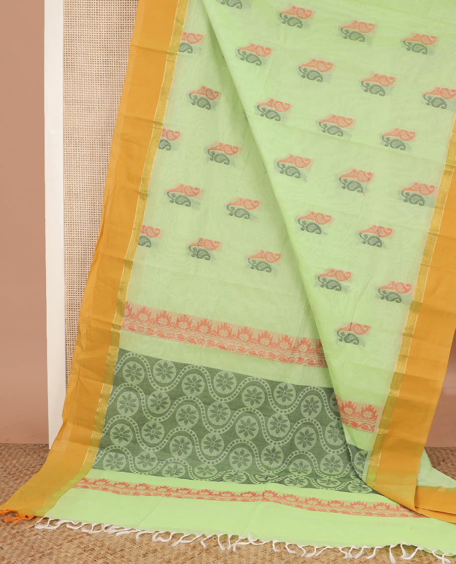 Pista green paisley buttas kanchi cotton saree, contrast plain border, and chakram design pallu