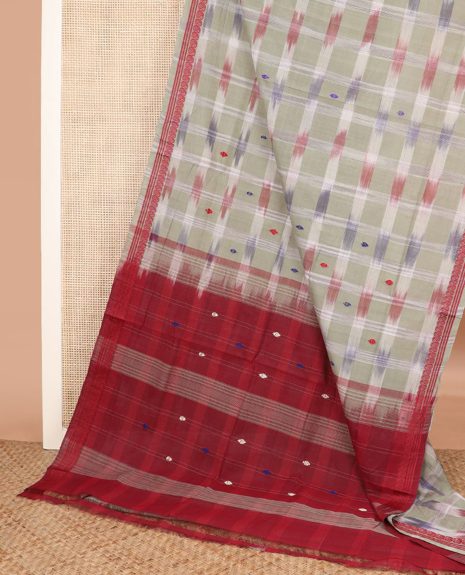 Pale green buttas and checked Andhra cotton saree, paisley border, and contrast pallu of stripes and buttas