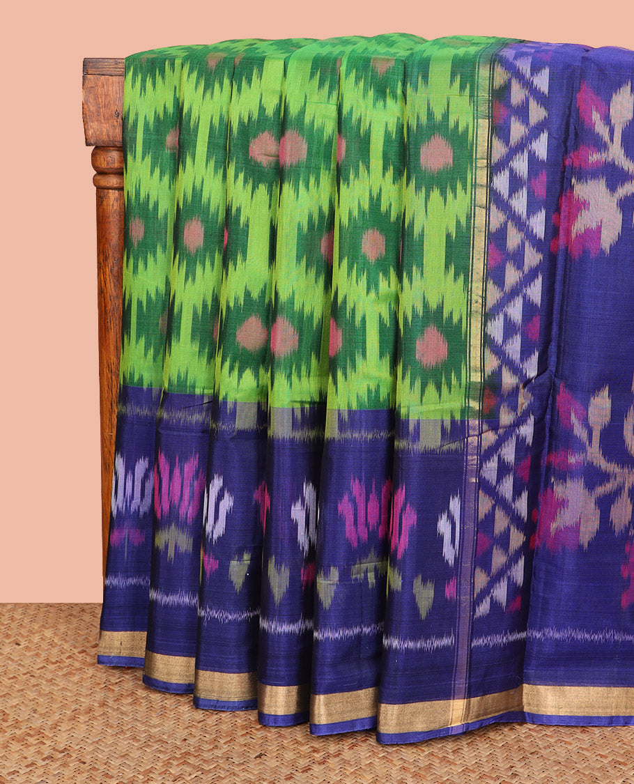 Green Ikkat Cotton Saree, Embellished with Ikkat-Style Buttas All Over Its Body, Complemented by a Contrast Border of Lotus Motifs in Ikkat-Style Weave, Pallu of Floral Designs in Ikkat Weave, and Paired with a Contrast Blouse