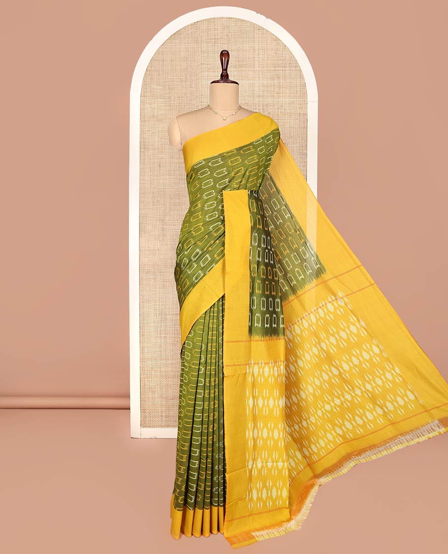 Green Ikkat Cotton Saree, Embellished with Ikkat-Style Buttas on Its Body, Complemented by Contrast Border, Pallu Steeped with Ikkat Buttas, and Has No Blouse