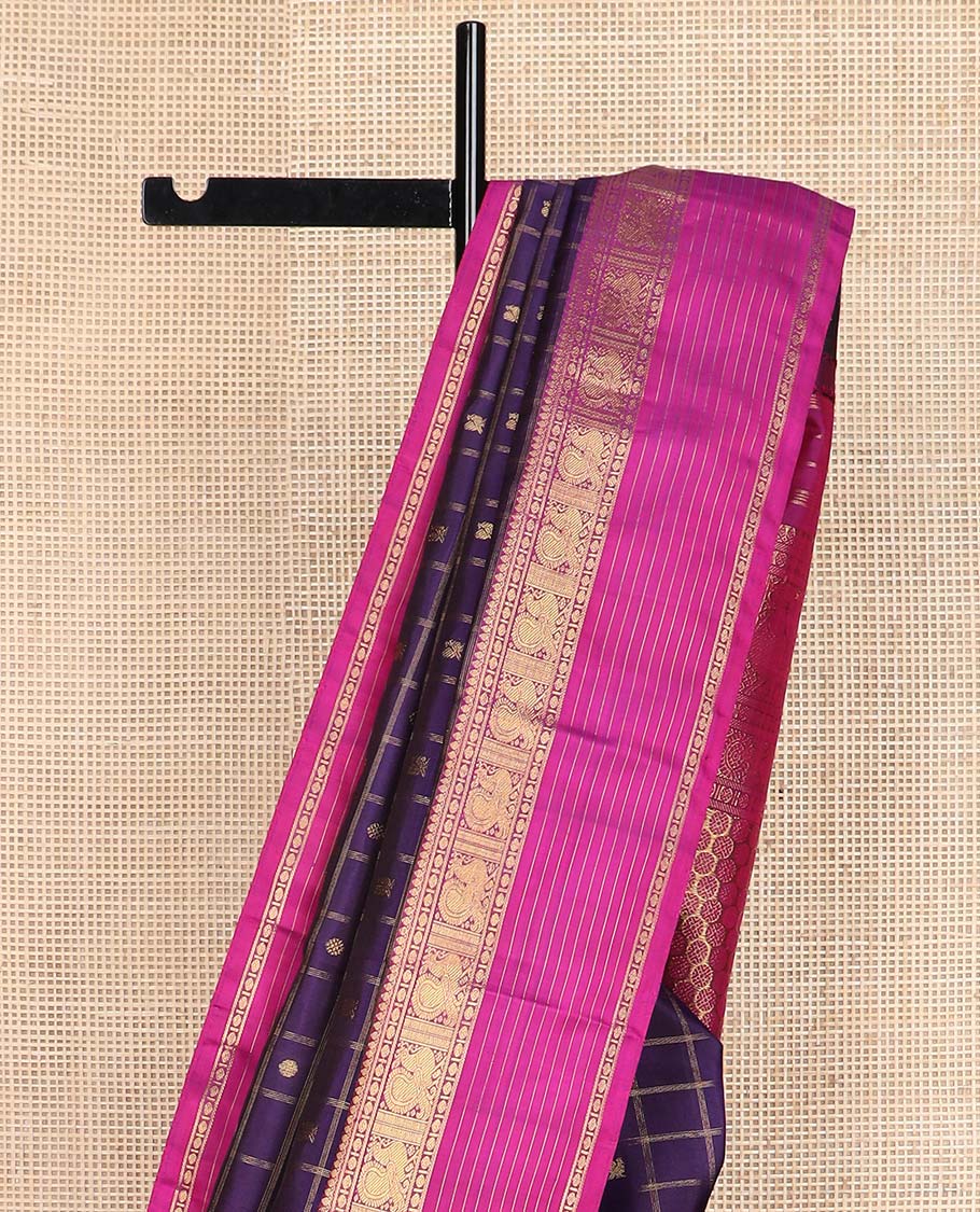 Eggplant purple annam chakram buttas enclosed checked Kanchipuram silksaree, contrast border of thilakm mokku, laddu kamalam, and mayil designs, and intricate pallu