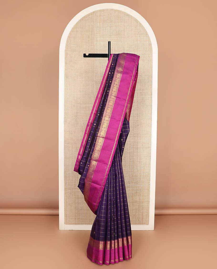 Eggplant purple annam chakram buttas enclosed checked Kanchipuram silksaree, contrast border of thilakm mokku, laddu kamalam, and mayil designs, and intricate pallu