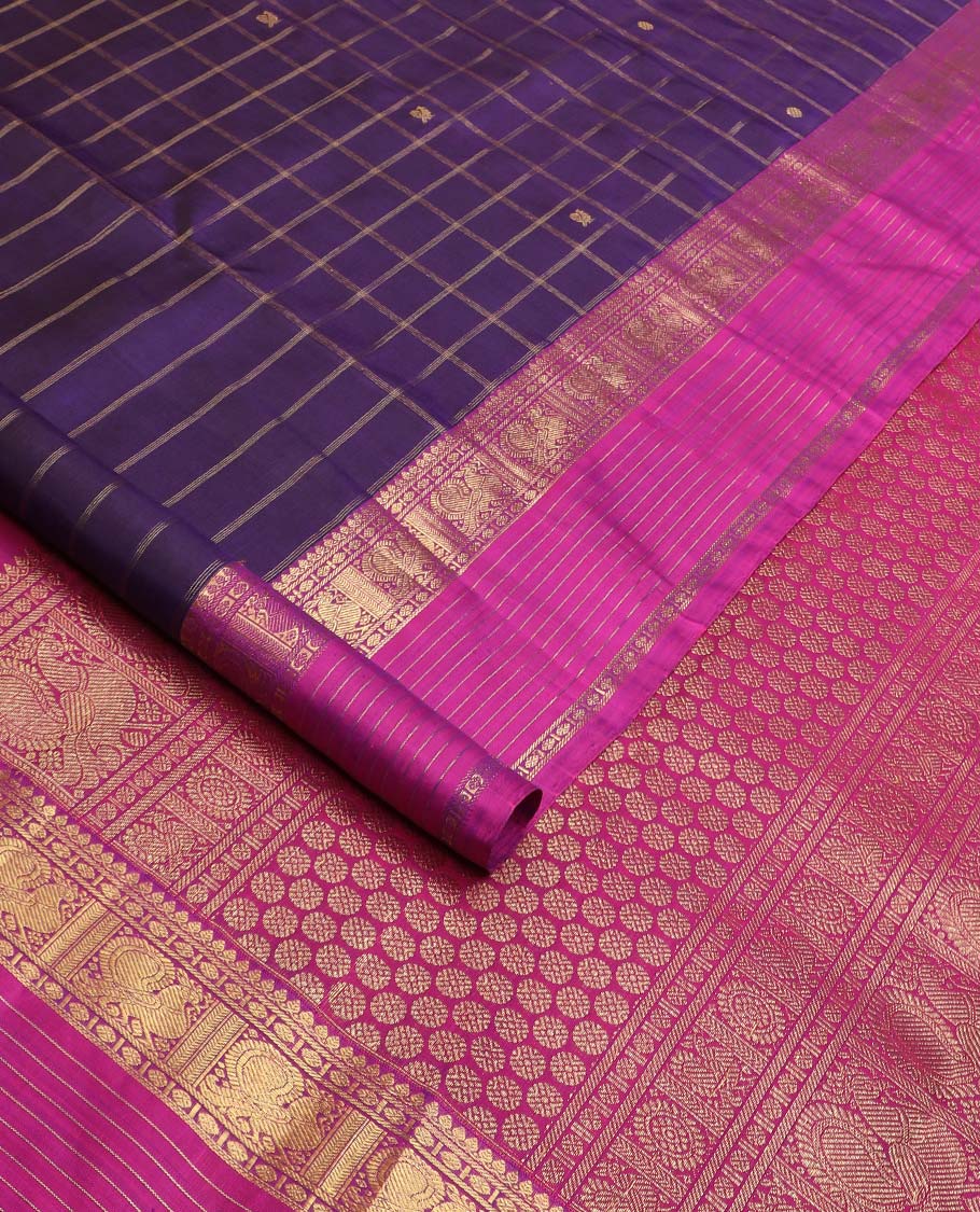 Eggplant purple annam chakram buttas enclosed checked Kanchipuram silksaree, contrast border of thilakm mokku, laddu kamalam, and mayil designs, and intricate pallu