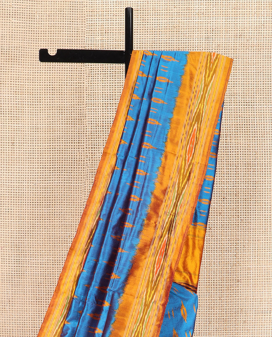 Blue Ikkat Silk Saree Enlivened with Ikkat Buttas, Featuring a Contrast Ikkat-Textured Border and a Pallu Steeped in Ikkat Textures and Stripes