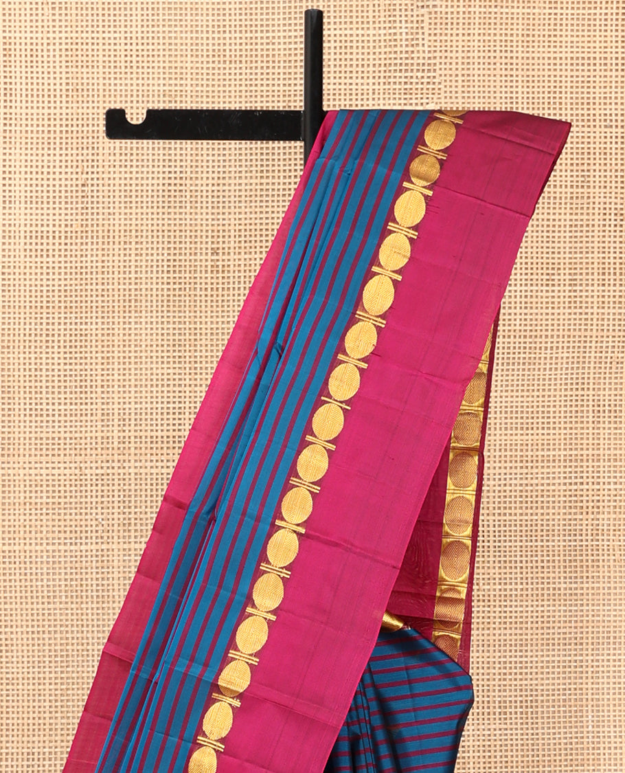 Blue Striped Kanchipuram Silk Saree, Complemented by a Contrast Kal Eragina Border of Rudraskham Design, Pallu of Zari Design, and a Contrast Blouse