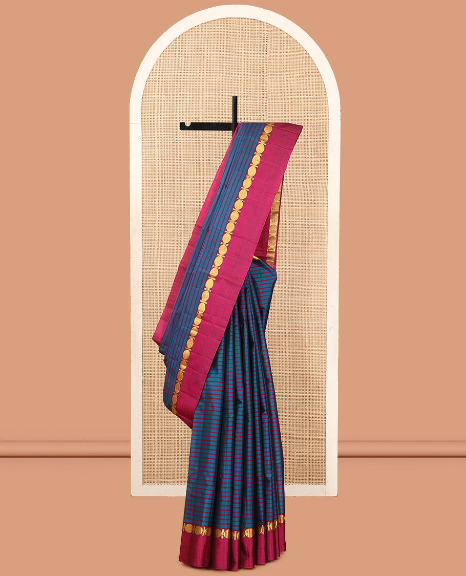 Blue Striped Kanchipuram Silk Saree, Complemented by a Contrast Kal Eragina Border of Rudraskham Design, Pallu of Zari Design, and a Contrast Blouse