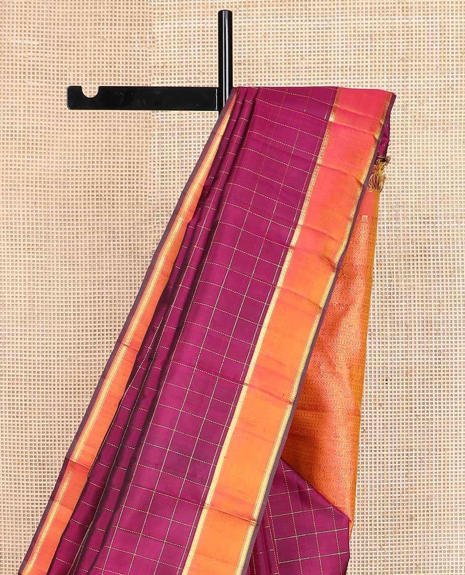 Purple muthu kattam Kanchipuram silk saree, contrast rettai pettu zari border, and pallu steeped with traditional zari designs
