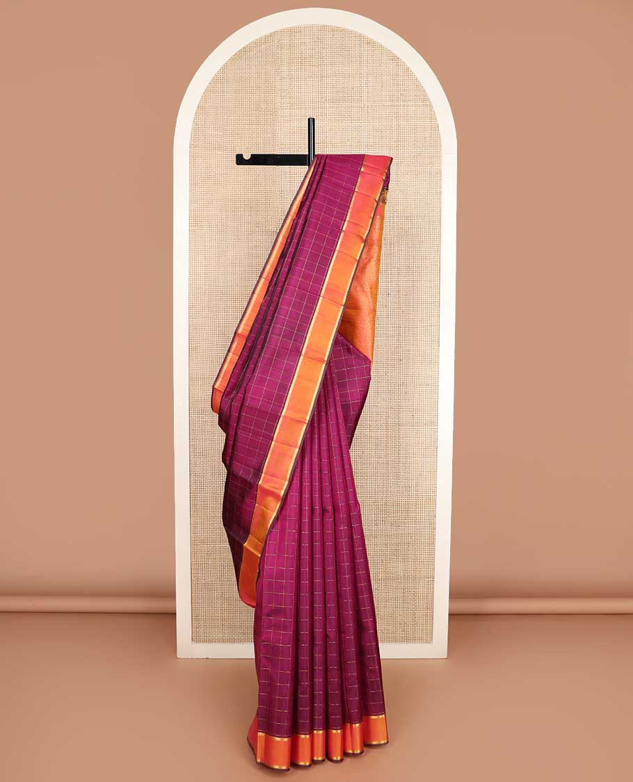 Purple muthu kattam Kanchipuram silk saree, contrast rettai pettu zari border, and pallu steeped with traditional zari designs
