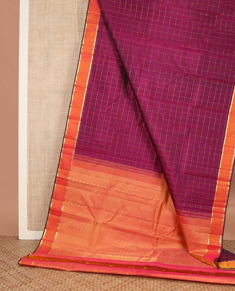 Purple muthu kattam Kanchipuram silk saree, contrast rettai pettu zari border, and pallu steeped with traditional zari designs