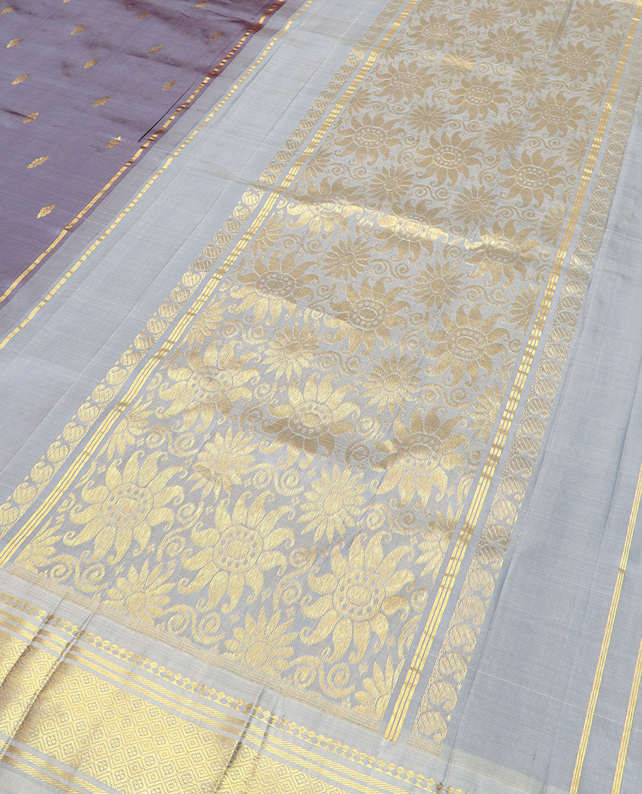 Grey zari buttas Kanchipuram silk saree, zari border of paneer sombu, banaras, and jaal designs, and floral design pallu