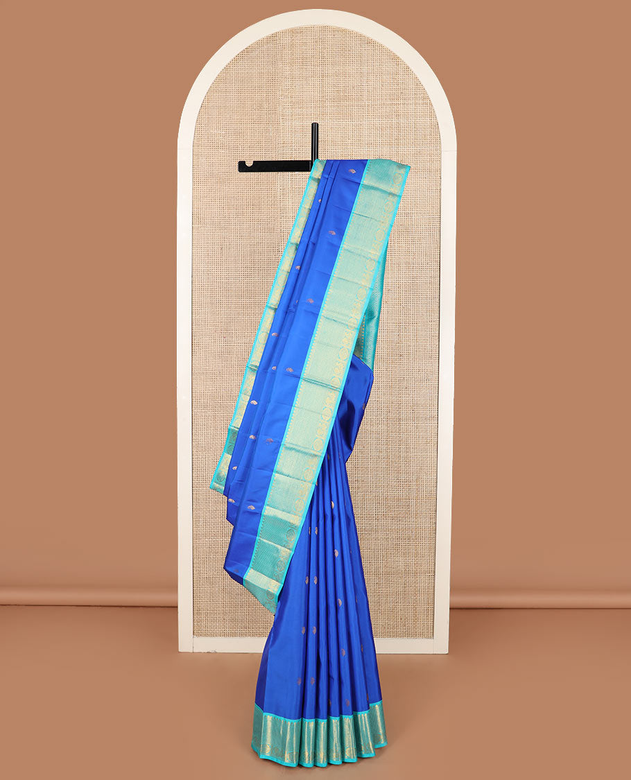 Blue vanki manga buttas Kanchipuram silk saree, contrast korvai border of salngai, banaras, ara maadam, and anna chakram designs, and jaal pallu