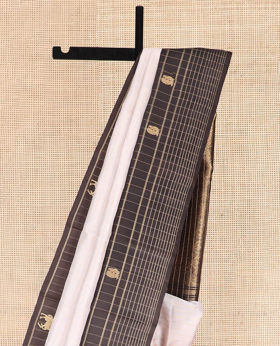 White Kanchipuram Silk Saree Decorated with Stripes All Over Its Body, Complemented by a Contrast Border of Muthu Kattam and Annam Buttas, Pallu of Jaal Design, and Paired with a Contrast Blouse
