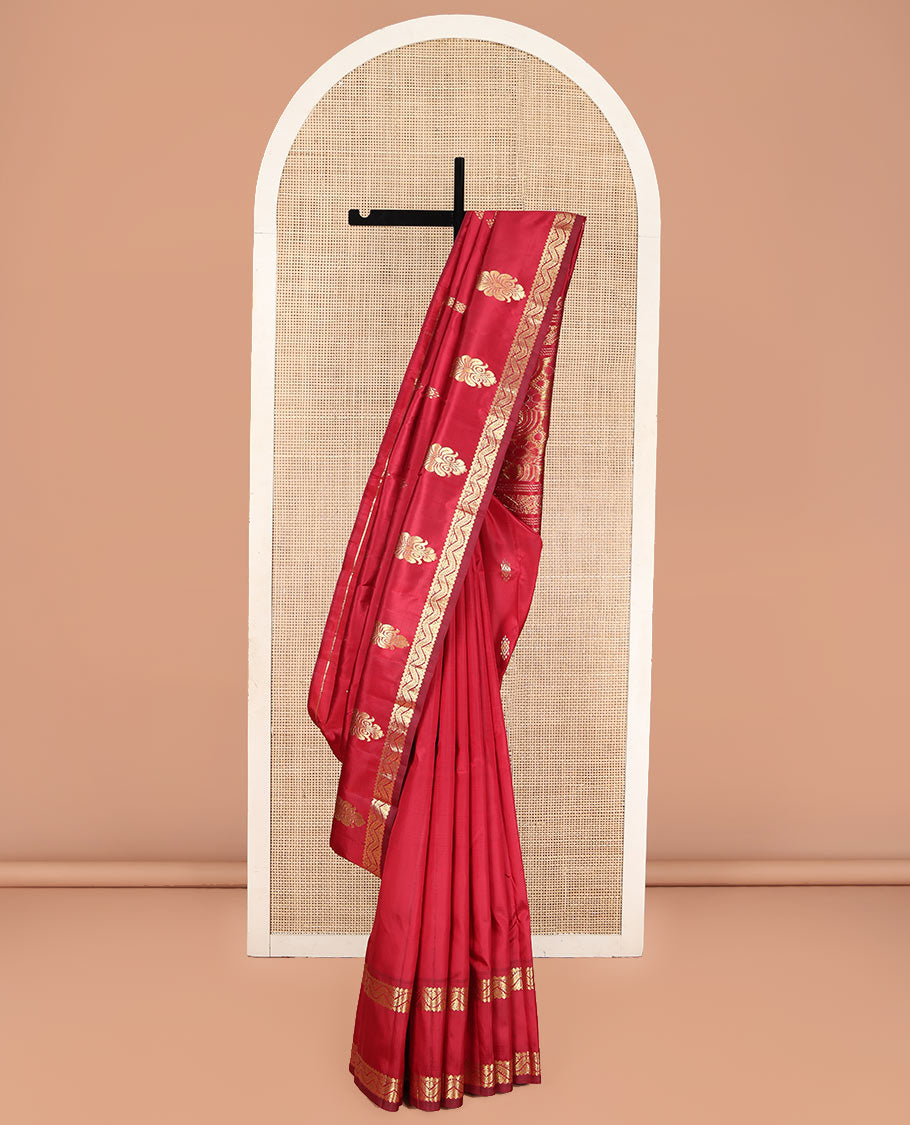 Red Kanchipuram Silk Saree, Beautified with Zari Buttas, Highlighted by Rettai Pettu Traditional Zari Motifs Woven Border, Pallu Features Floral Designs, and Comes Without a Blouse